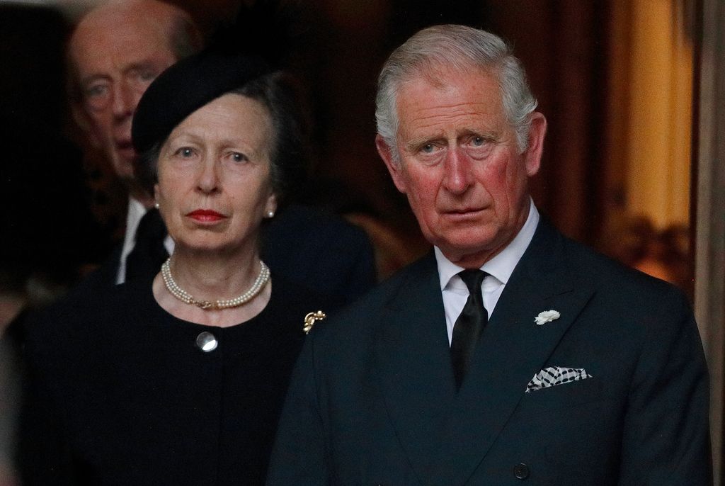 Princess Anne and King Charles looking serious at Queen Elizabeth II's funeral in 2022