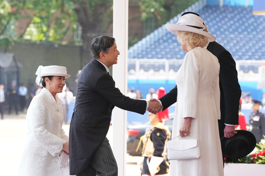 King Charles shakes hands with Japan's Emperor Naruhito during the ceremonial welcome