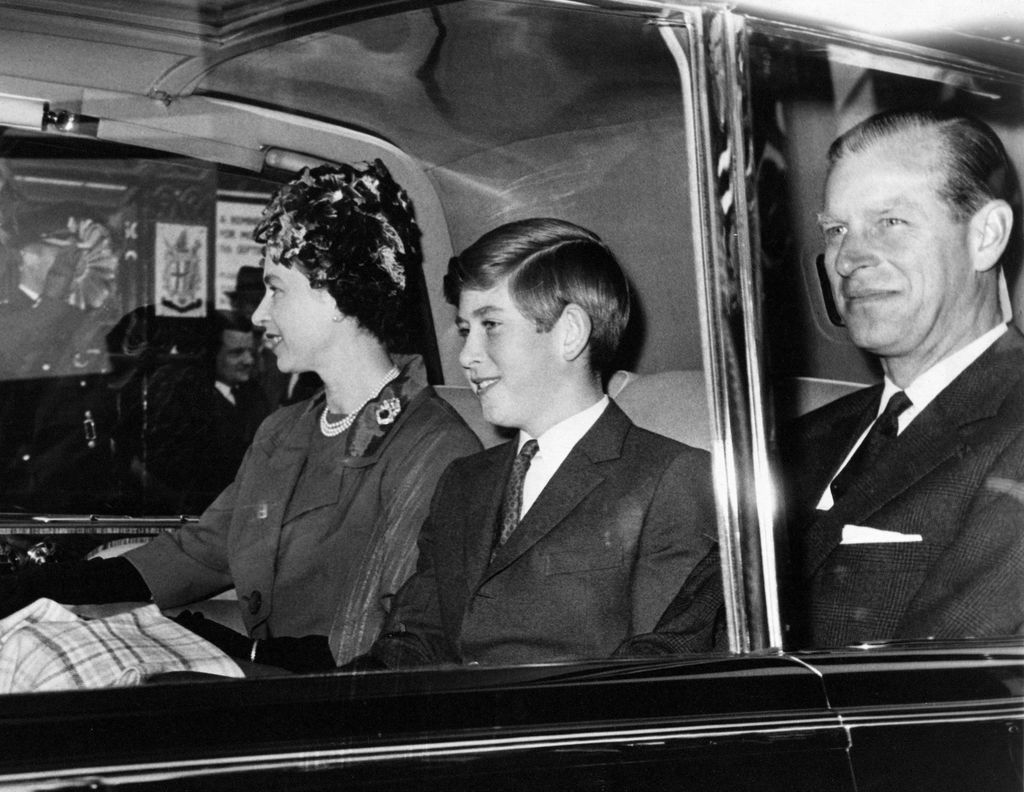 The Prince of Wales pictured with his parents, Queen Elizabeth II and Prince Philip the Duke of Edinburgh, leaving Euston Station after travelling overnight from Aberdeen. 25 September 1961 