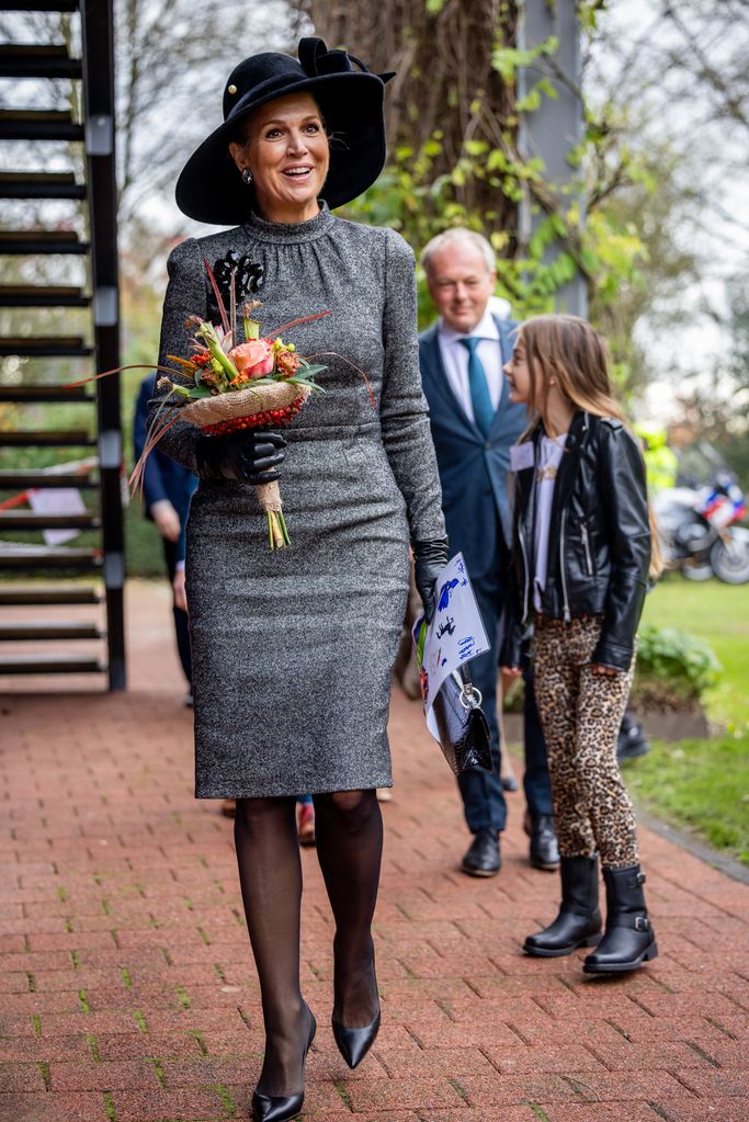 Queen Maxima Of The Netherlands Attends The Celebration Of The 30th Anniversary Of Home-Start In Culemborg wearing grey tweed Dolce and Gabbana dress