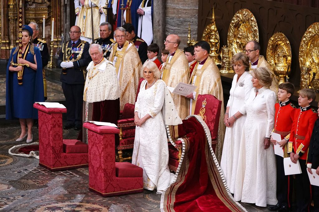 King Charles III and Queen Camilla stand after entering Westminster Abbey through the Great West Door