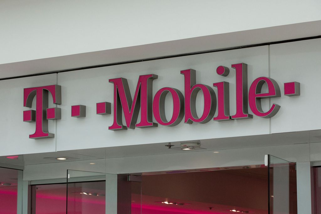The T-Mobile logo is seen outside a shop in Washington, DC, on July 26, 2019. - US antitrust authorities approved the USD 26 billion merger of T-Mobile and Sprint in a deal that brings together the third- and fourth-largest wireless operators as the indus
