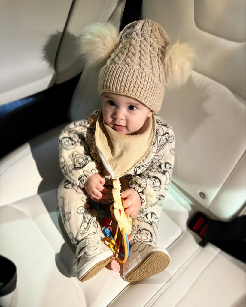 A photo of Lyra Rose sitting in the car