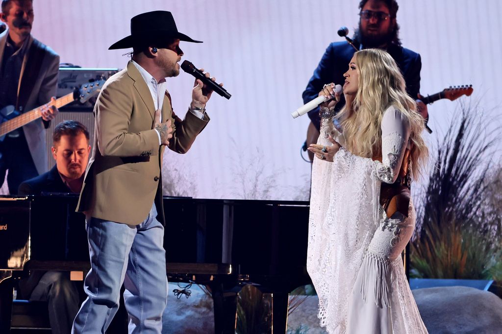 Cody Johnson and Carrie Underwood perform onstage during The 58th Annual CMA Awards