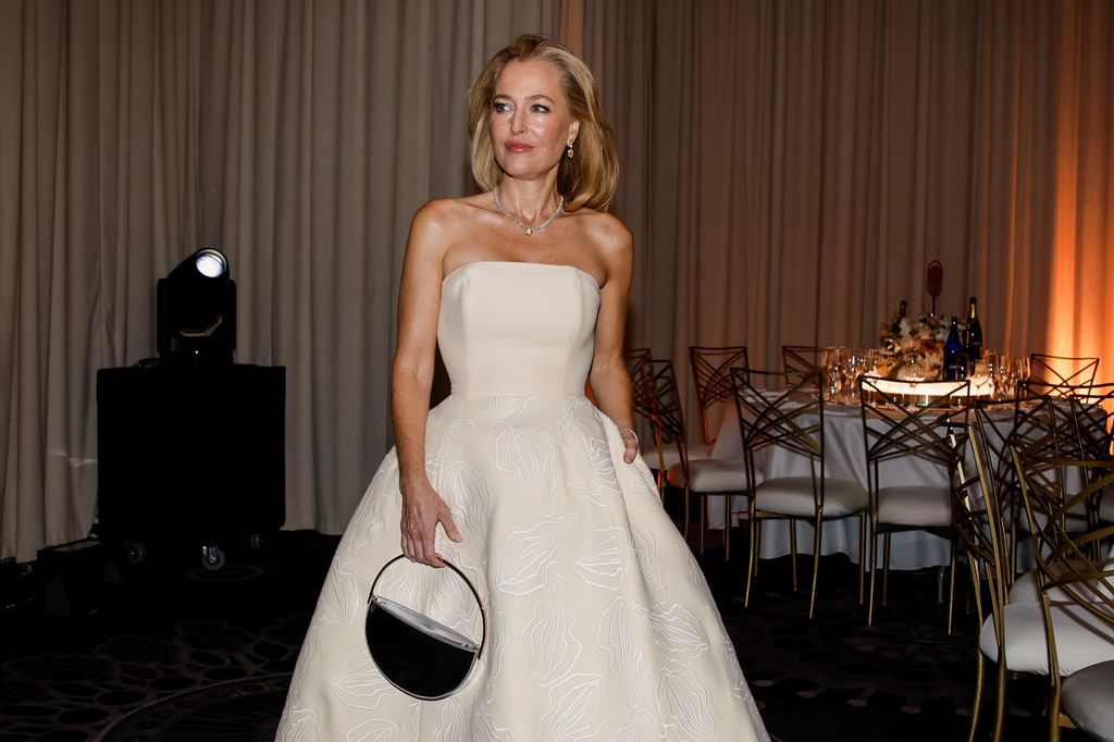 gillian anderson in white dress at the golden globes 