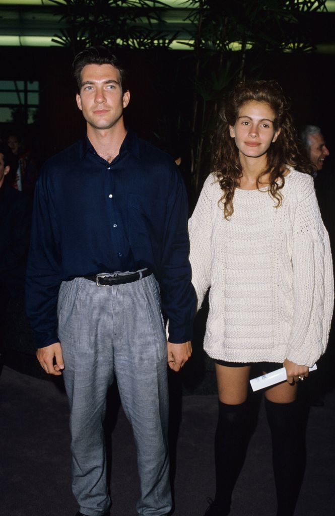 Julia Roberts in a white jumper and shorts with Dylan McDermott 