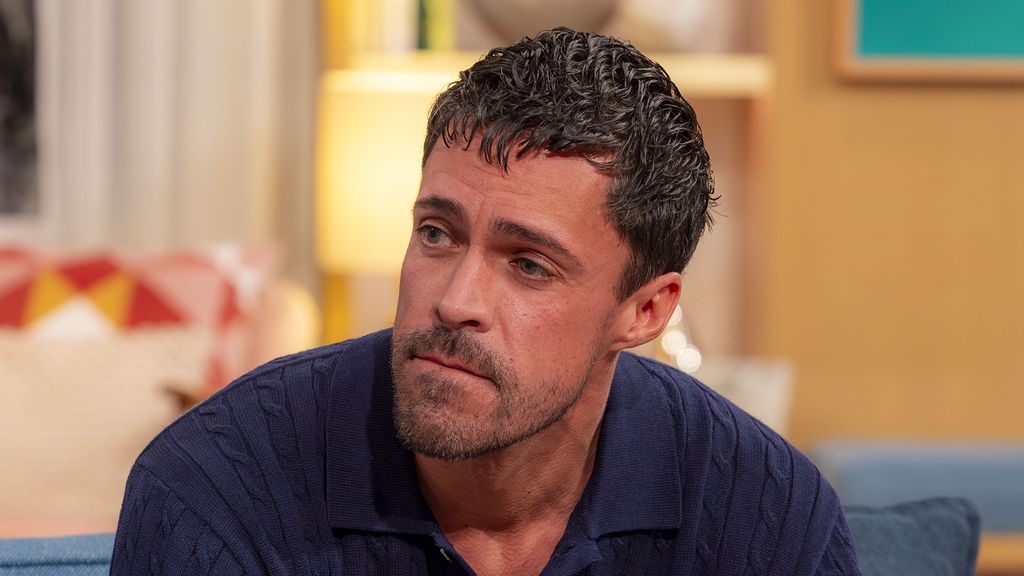 Olly Rix wearing a navy jumper on This Morning