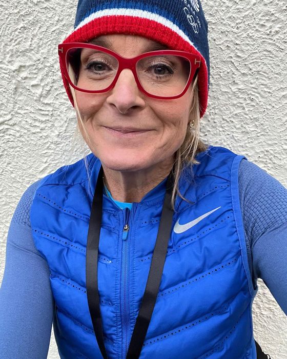 Louise Minchin smiling for a selfie, dressed in outdoor running gear