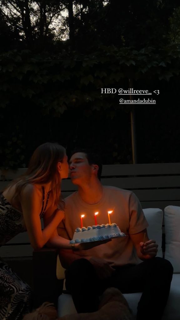 will reeve holding birthday cake and kissing fiancee amanda dubin