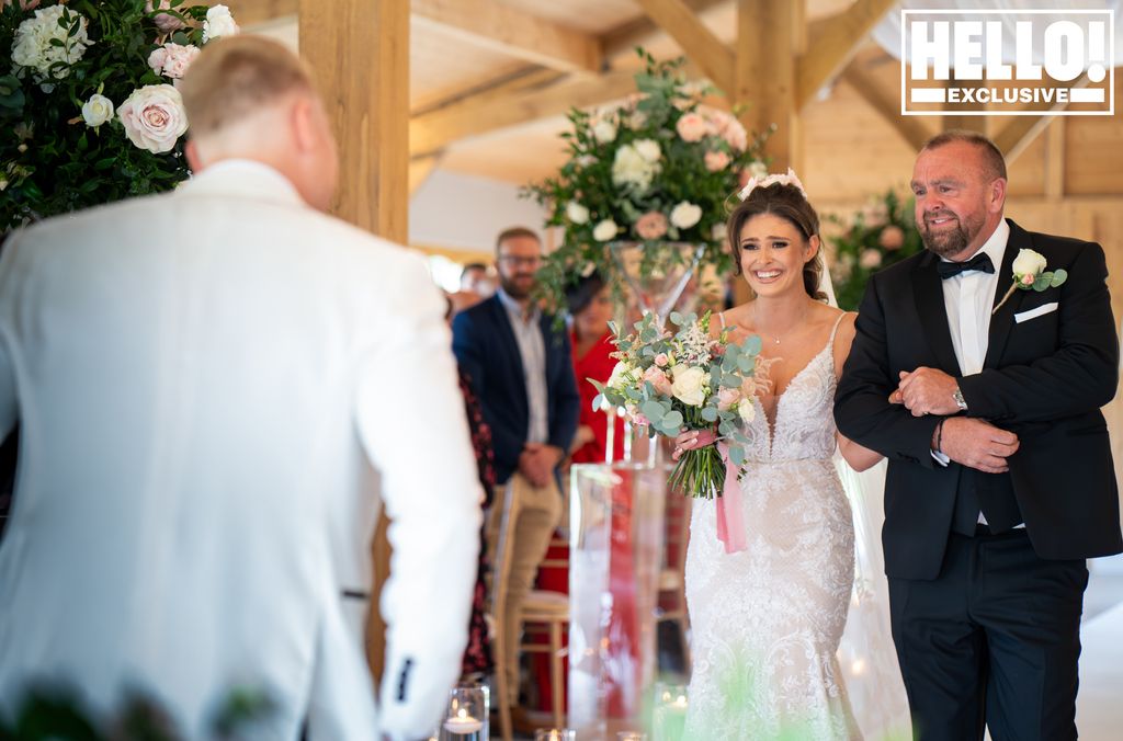 Emilie Cunliffe walking down the aisle with her dad