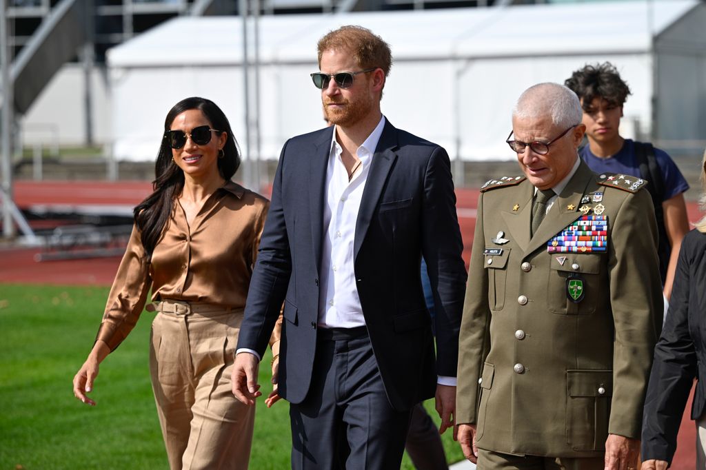 In 2023, the Duchess wore a brown silk L'Agence blouse while at the Invictus Games in Dusseldorf