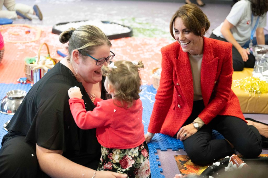 Princess Kate sitting with one-year-old Skylar during a portage session