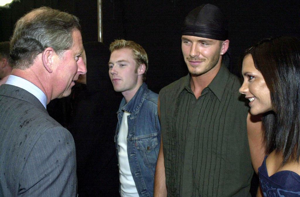 King Charles talking to Victoria Beckham and David Beckham 