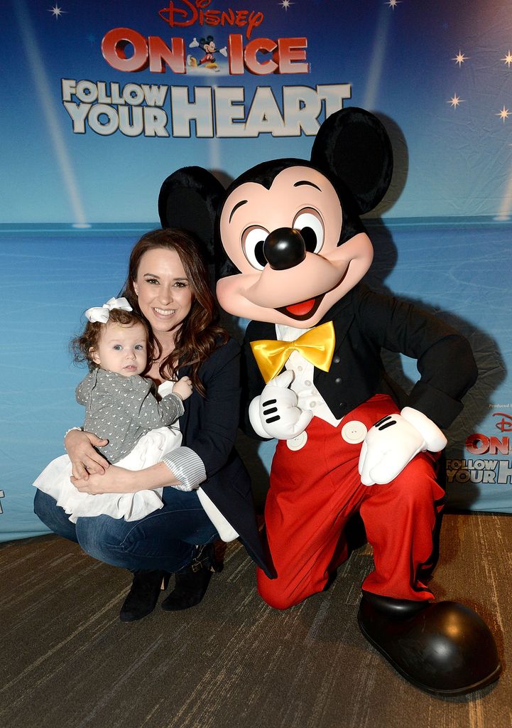 LOS ANGELES, CA - DECEMBER 16: Actress Lacey Chabert (C) her daughter Julia Mimi Bella Nehdar and Mickey Mouse attend Disney On Ice: Follow Your Heart at Staples Center on December 16, 2017 in Los Angeles, California.  (Photo by Andrew D. Bernstein/Getty Images for Feld Entertainment)