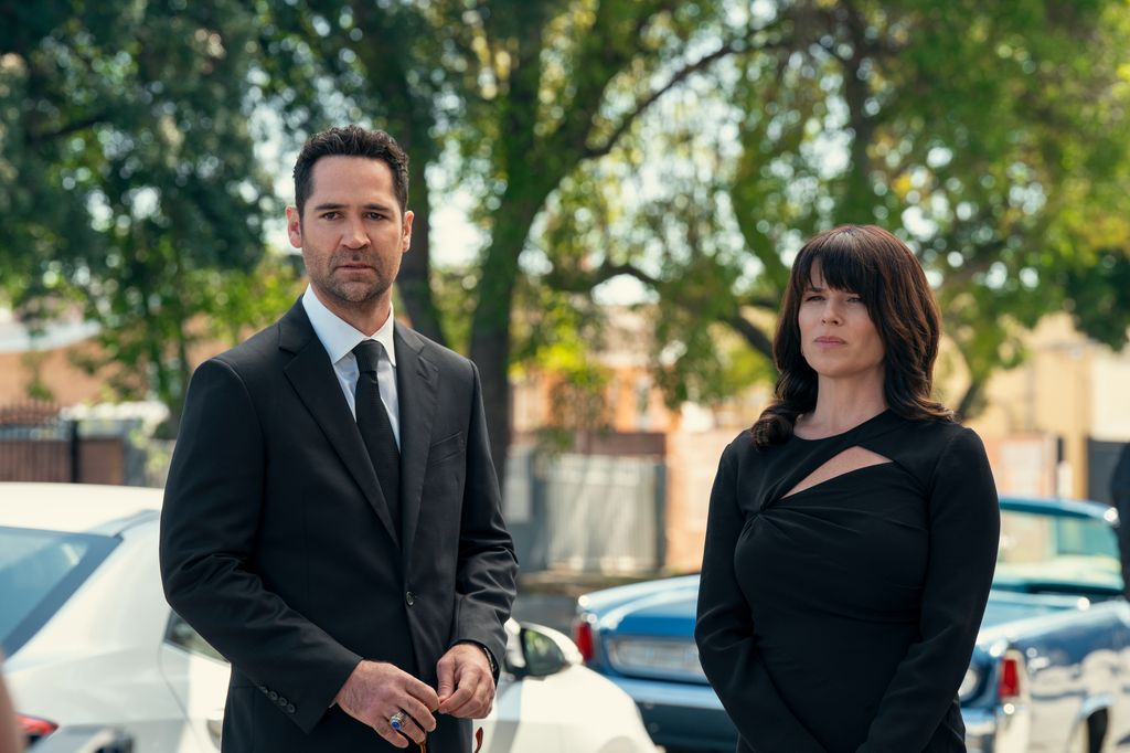 Manuel Garcia-Rulfo as Mickey Haller, Neve Campbell as Maggie in episode 303 of The Lincoln Lawyer