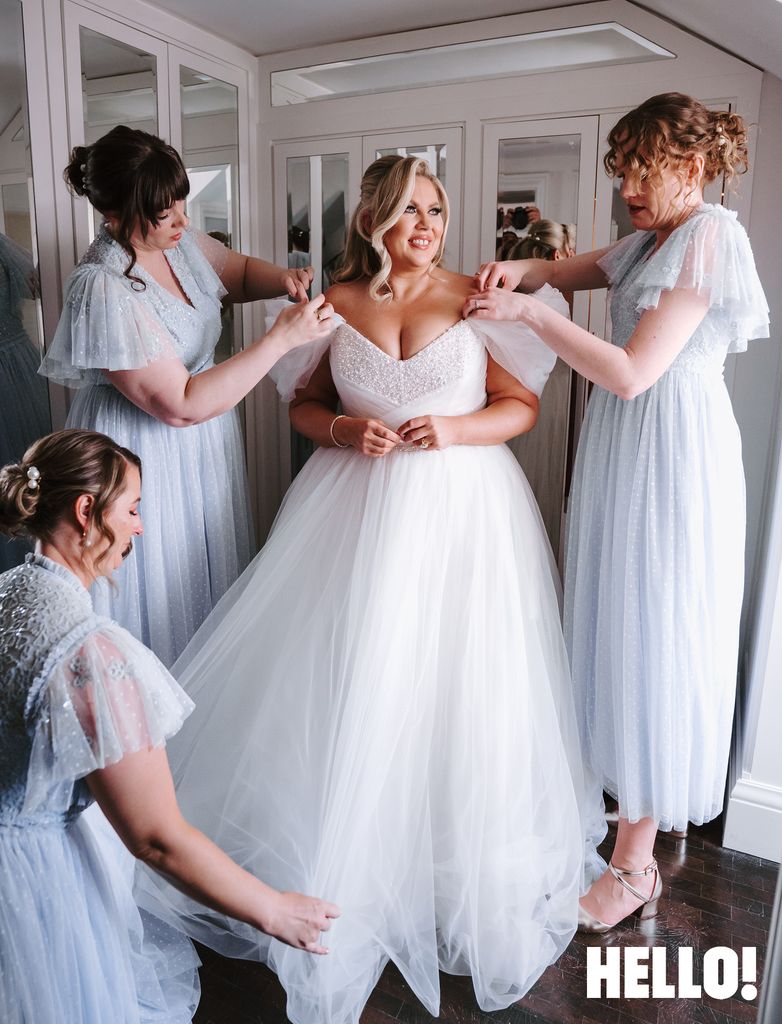 Louise Pentland's bridesmaids looking at her wedding dress