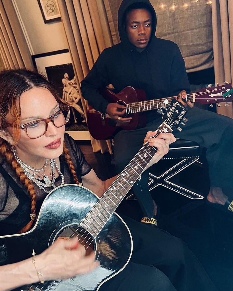 madonna and david banda playing guitar