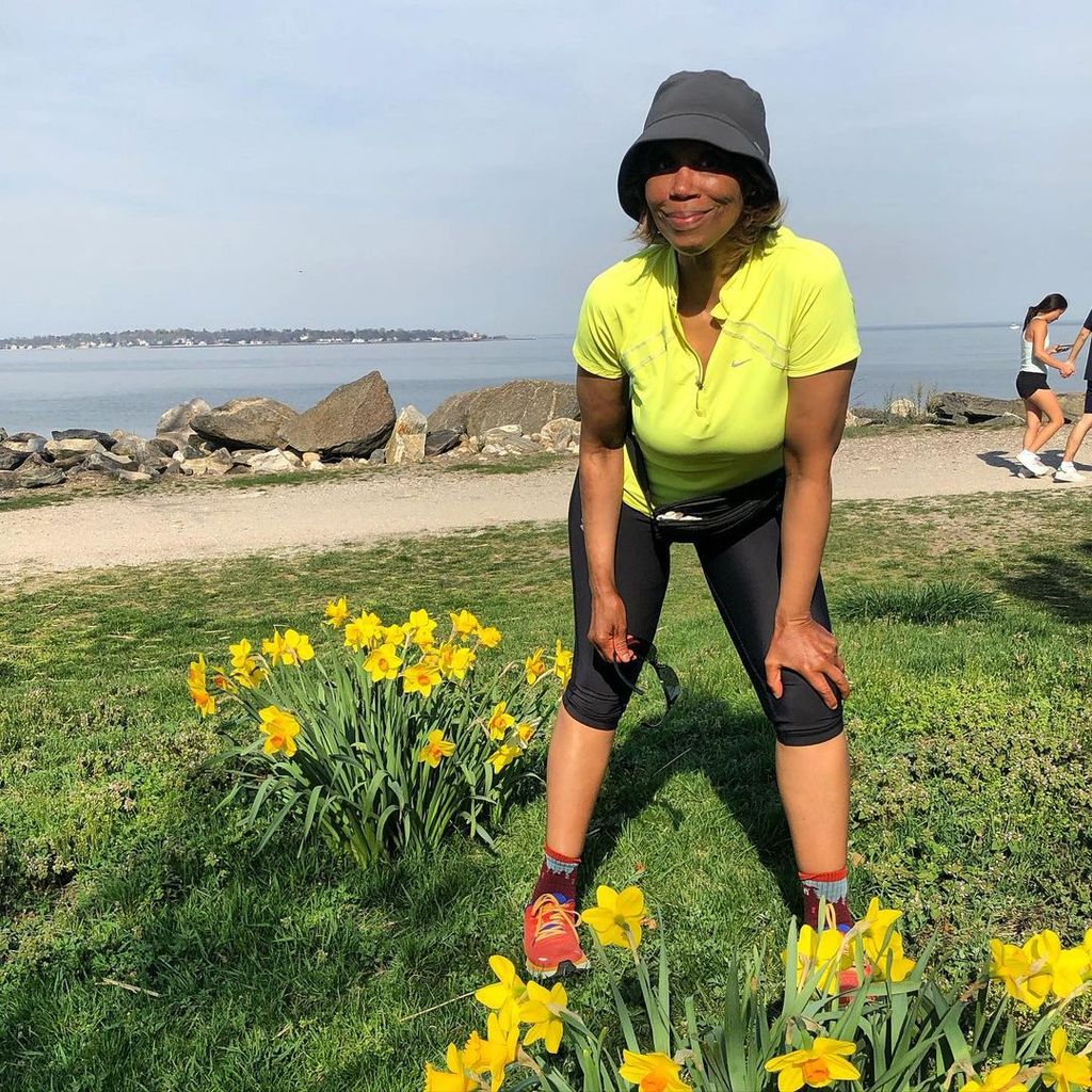 Trisha takes a photo on the Connecticut coast