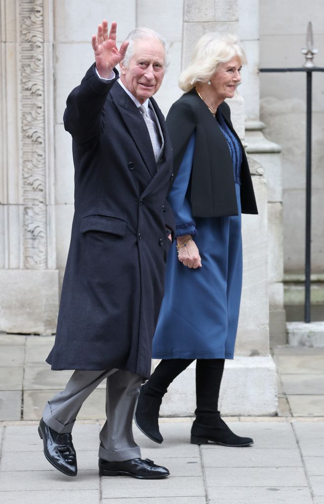 Charles waves as he leaves hospital with Camilla