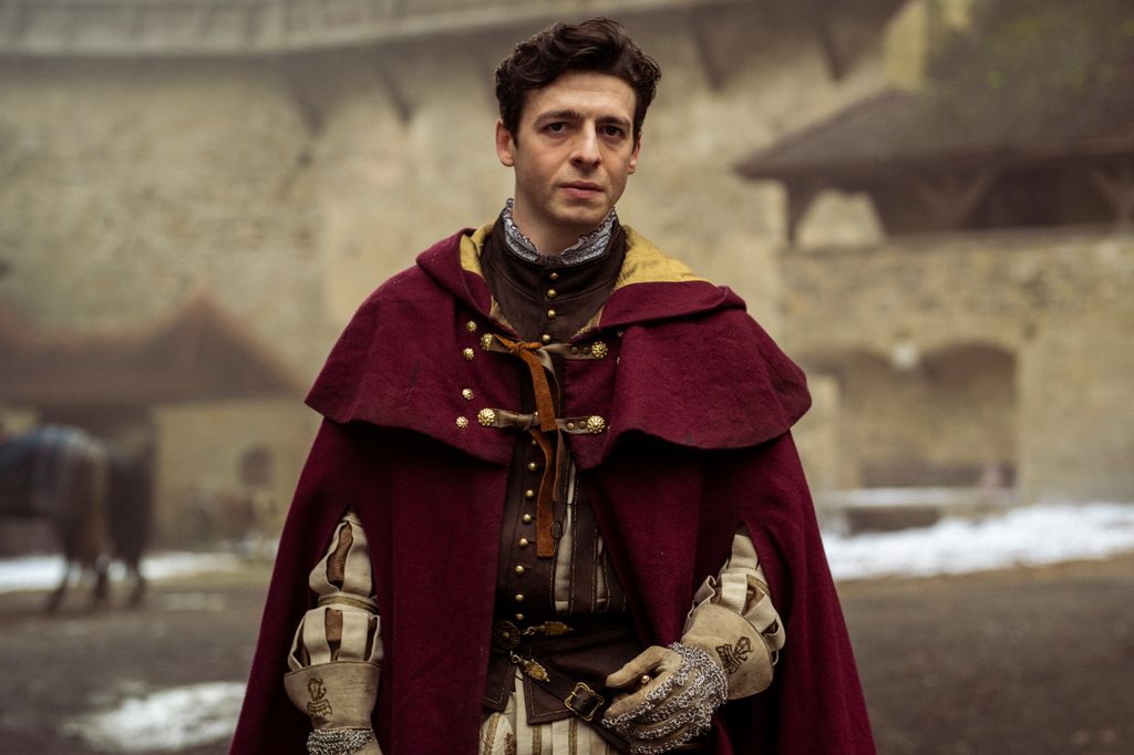 man wearing red cloak