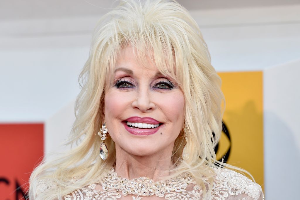 Dolly Parton in a white embellished dress