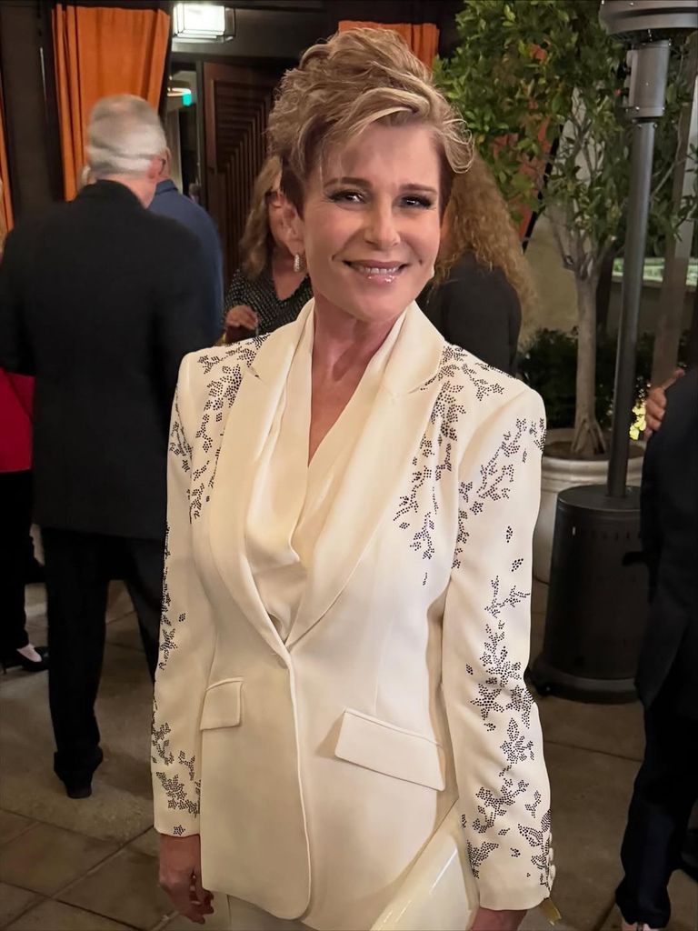 judi evans haircut white suit
