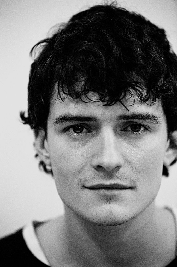 Orlando Bloom stares into the camera lens in a throwback photo