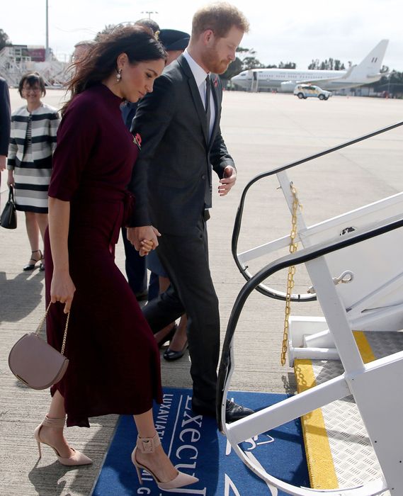 meghan and harry boarding a plane
