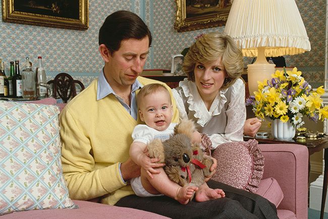 Prince Charles sits with baby Prince William on his lap beside Princess Diana at their home in Kensington Palace, London, England, 1st February 1983