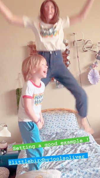 jools oliver jumping on bed with son river