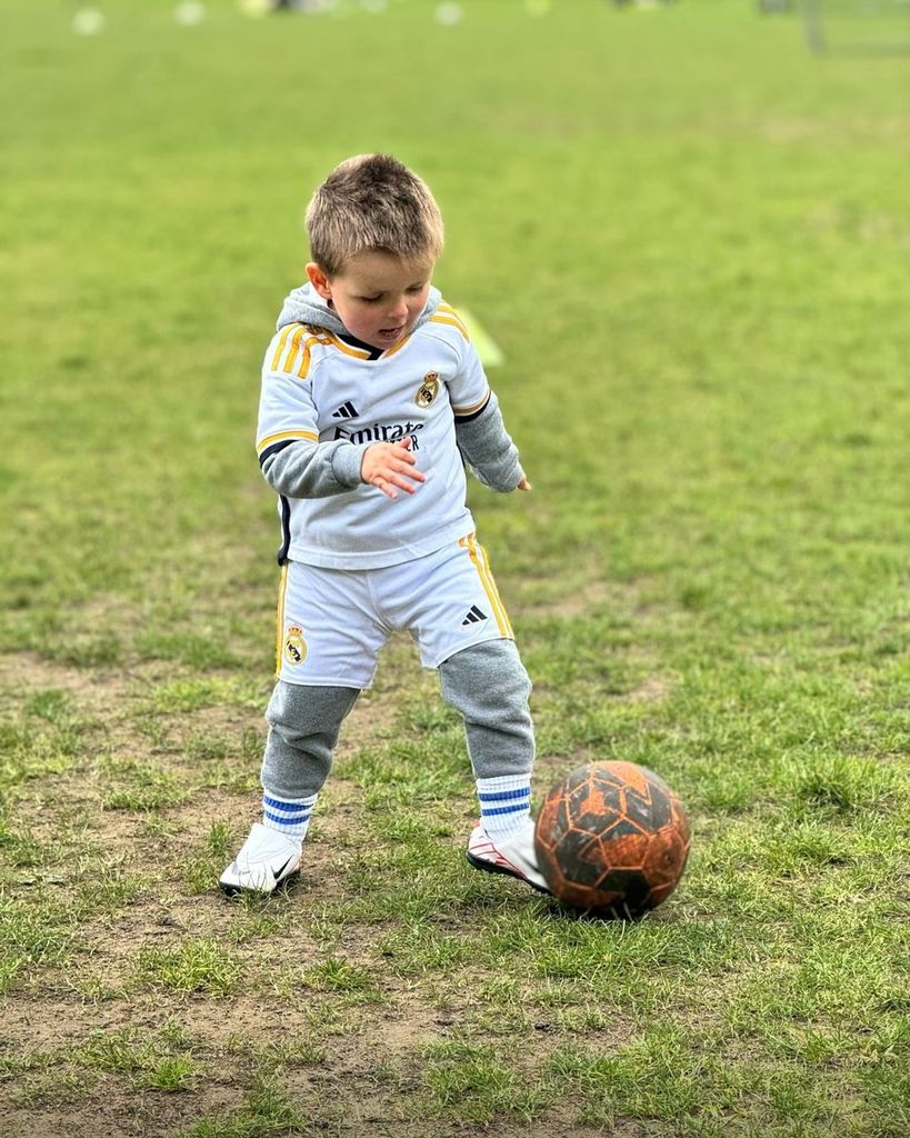 Jamie Redknapp's son Raphael kicking a football