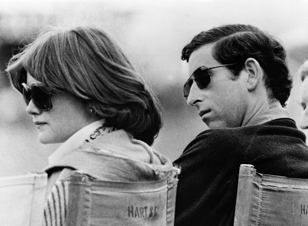 Prince Charles and Lady Sarah Spencer in a black and white photo, both of them wearing sunglasses