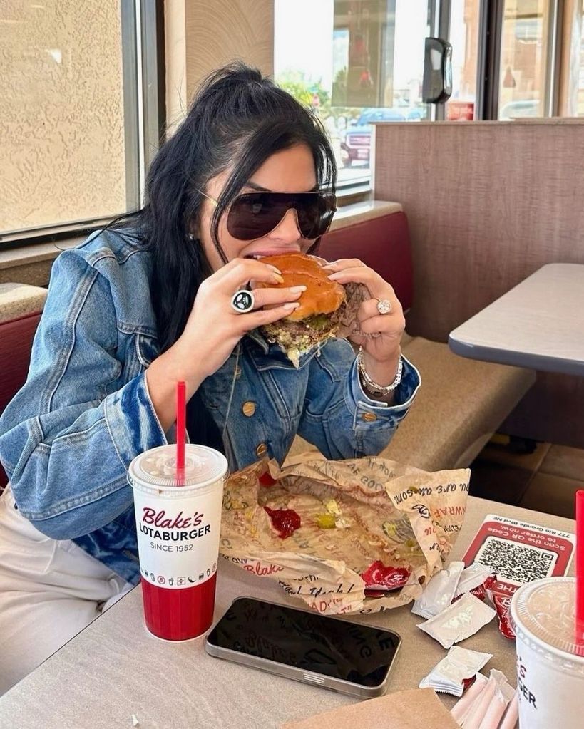 Lauren tucks into a burger in her family home town