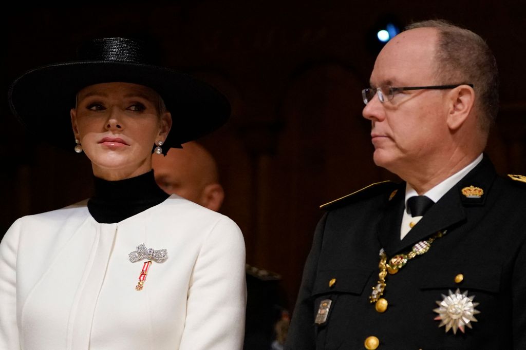 Princess Charlene and Prince Albert standing away from each other