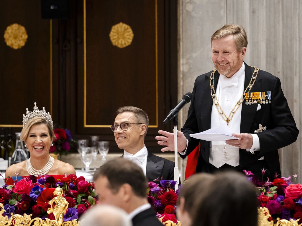 King Willem-Alexander (R) delivers a speech next to Queen Maxima (L) and Finland's president Alexander Stubb  during a state diner at the Royal Palace in Amsterdam on the first day of Stubb's two-day state visit to the Netherlands. (Photo by Remko de Waal / ANP / AFP via Getty Images) / Netherlands OUT