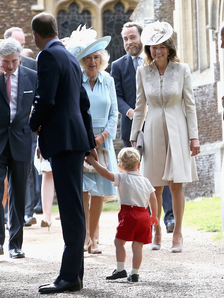 Carole Middleton smiles at Prince George as they leave the Church of St Mary Magdalene on the Sandringham Estate after the Christening of Princess Charlotte on July 5, 2015 