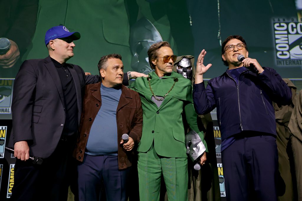 Kevin Feige, President, Marvel Studios, Joe Russo, Robert Downey Jr. and Anthony Russo speak onstage during the Marvel Studios Panel in Hall H at SDCC in San Diego, California on July 27, 2024.