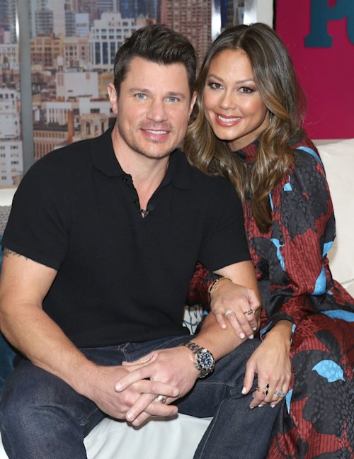 Nick Lachey and Vanessa Lachey cuddle up for a photo while visiting People Now on February 05, 2020 in New York