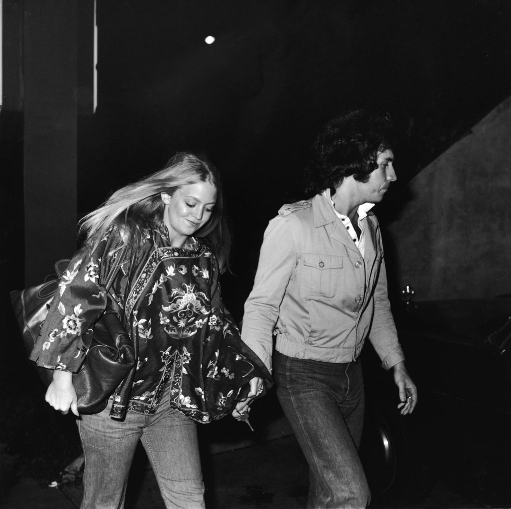 American actress Goldie Hawn and her second husband musician and television variety show host Bill Hudson arrive at the premiere of 'Taxi Driver,' February 8, 1976