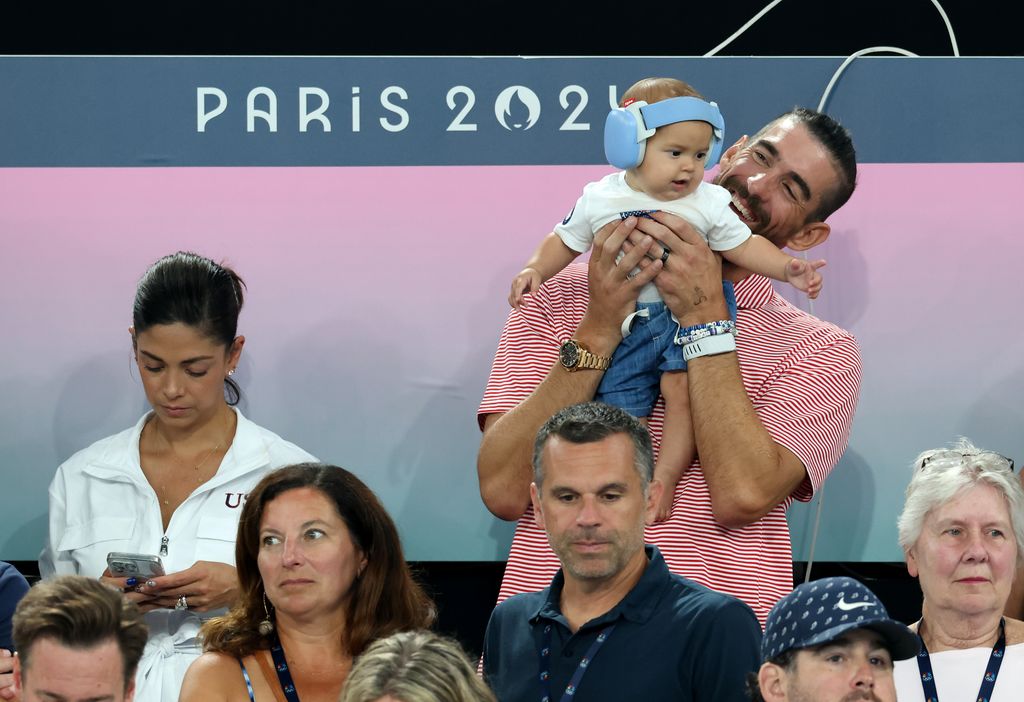 Michael Phelps celebrates the gold medals of Team United States during the Artistic Gymnastics Women's Team Final on day four of the Olympic Games Paris 2024 at Bercy Arena on July 30, 2024 in Paris, France