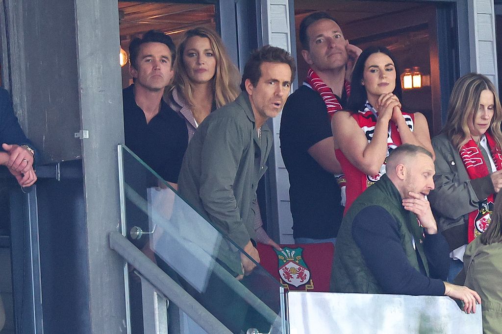 Ryan Reynolds co-owner of Wrexham watches on with Rob McElhenney and wide Blake Lively ahead of the Sky Bet League One match between Wrexham AFC and Charlton Athletic FC at Racecourse Ground on April 26, 2025 in Wrexham, Wales.