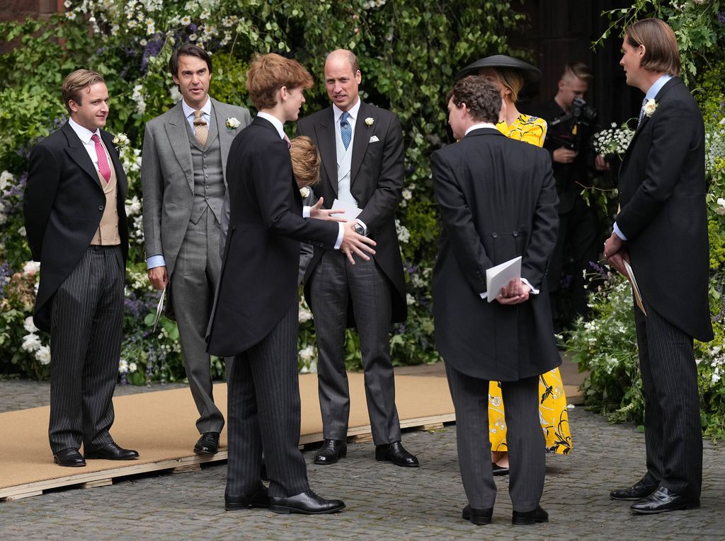 Prince William chats to guests after the Duke of Westminster's wedding to Olivia Henson