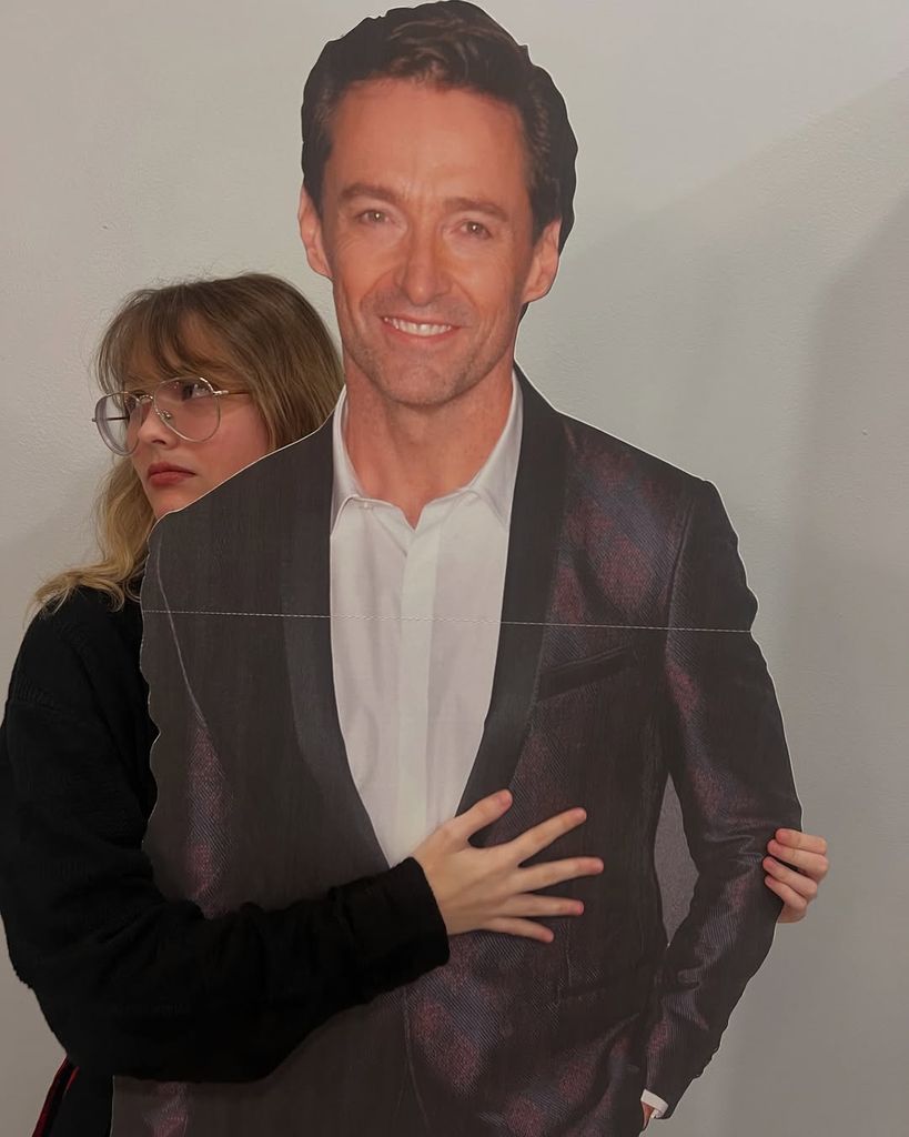 Dannielynn Birkhead poses beside her Hugh Jackman life-size cut-out for Christmas, shared on Instagram by dad Larry Birkhead