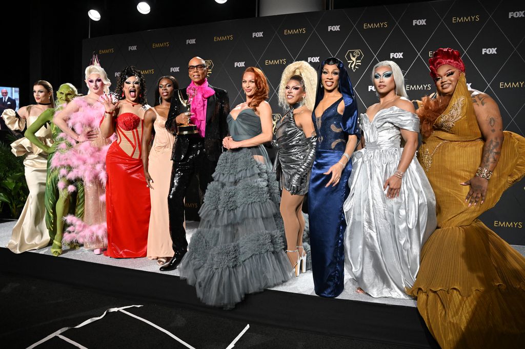 RuPaul standing with the contestants of RuPaul's Drag Race season 15