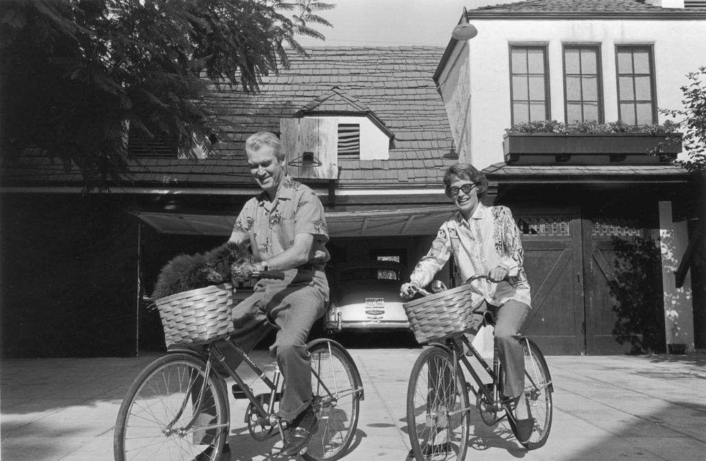 photo of jimmy stewart and gloria mclean riding bicycles