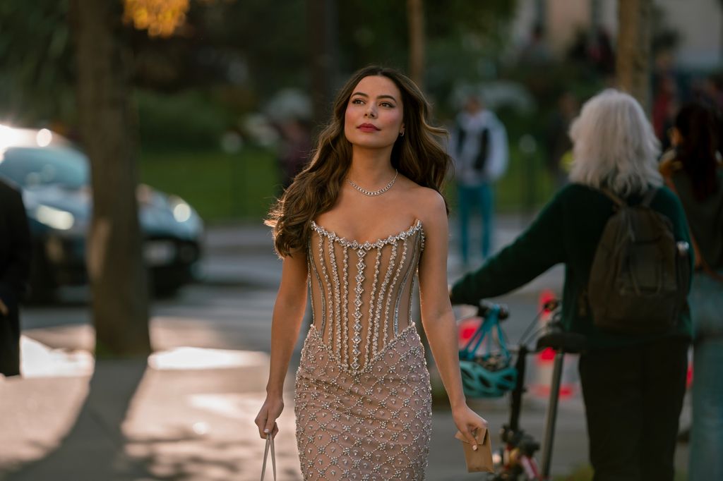 woman walking down street in dress