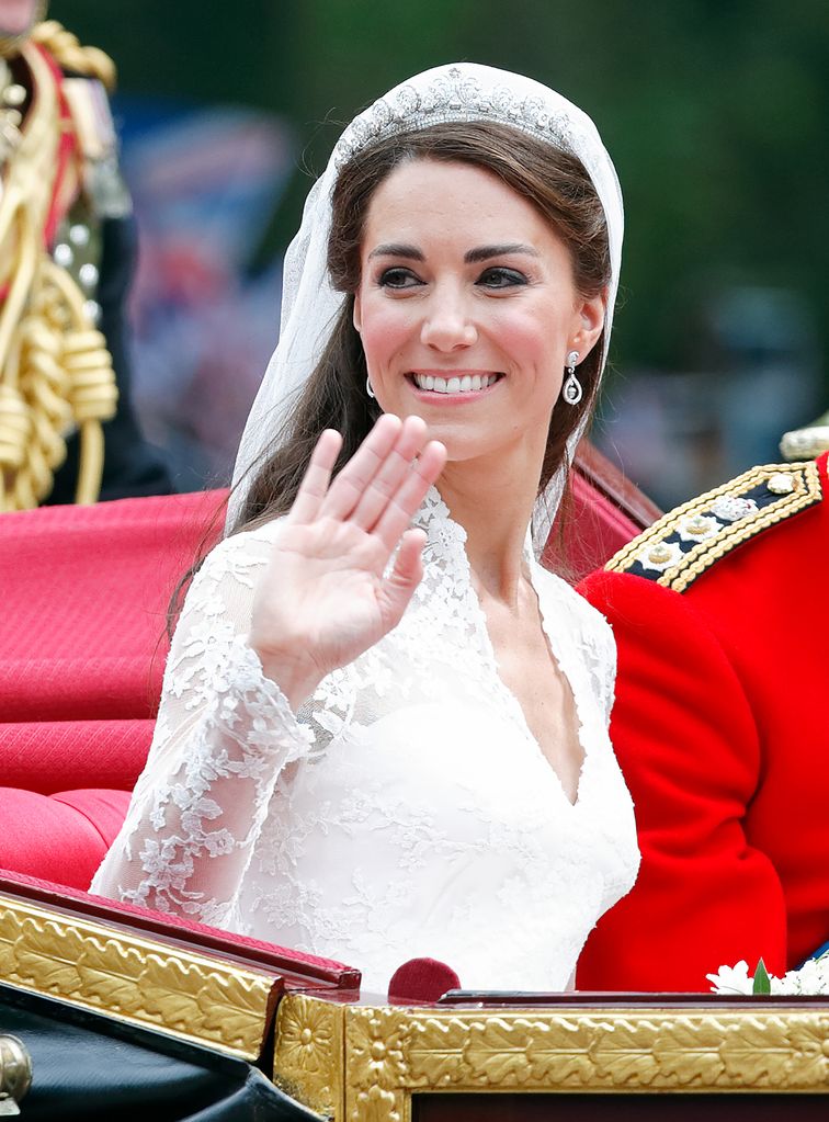 Kate in wedding dress in carriage