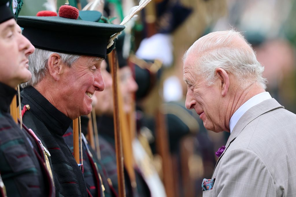 king charles speaking to man during ceremony of the keys 