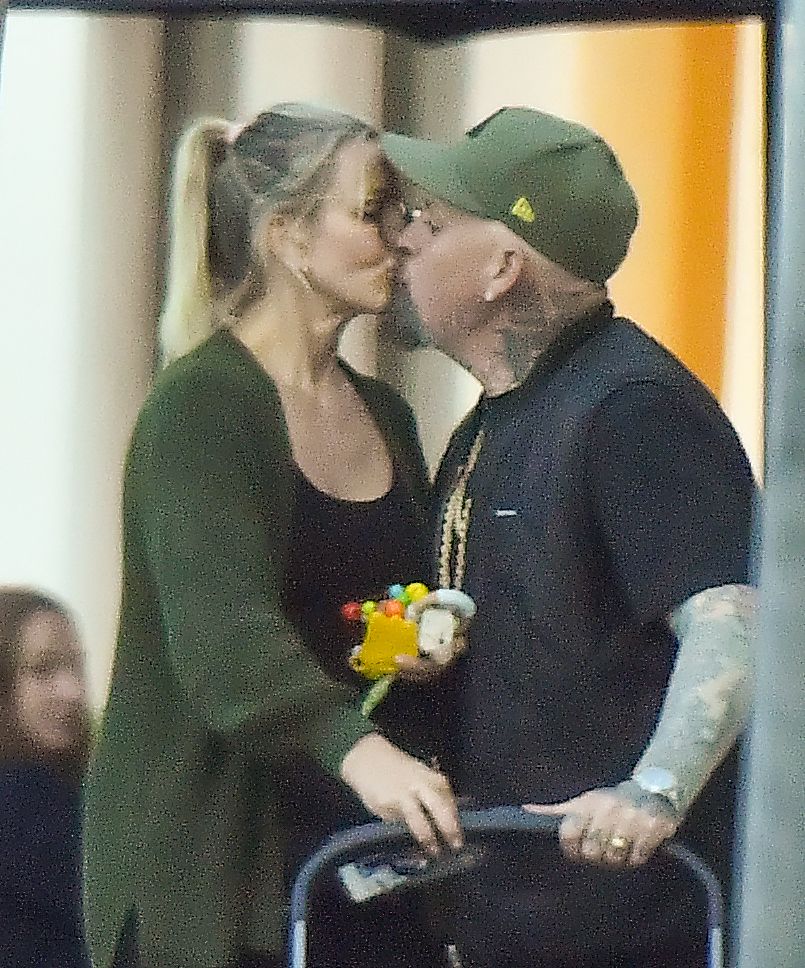 Cameron Diaz and husband Benji Madden share a sweet kiss as they leave a restaurant in Montecito