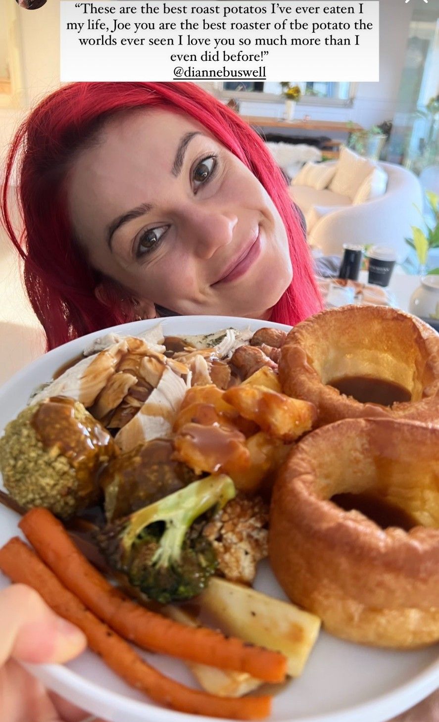 Dianne Buswell smiling with a roast dinner